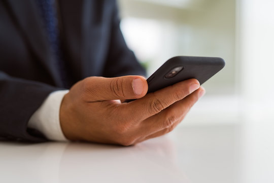 Close up of business man hands using smarpthone
