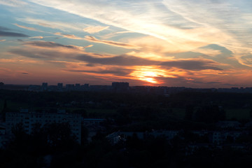City with a beautiful red sunset. City at night, sunset. Red beautiful sunset.