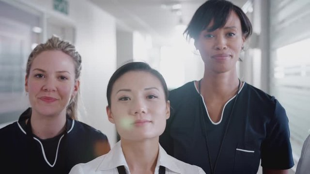 Portrait Of Female Medical Team Standing In Hospital Corridor