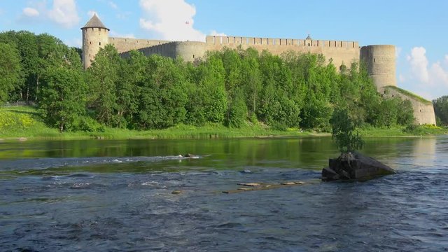 View of beautiful landscape with Ivangorod fortress across the Narva river.