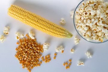 corn and popcorn on white background top view