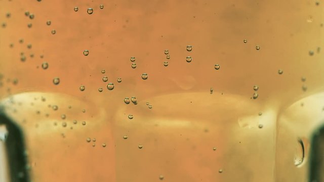 Effervescent tablet of vitamin C dissolving in glass of water