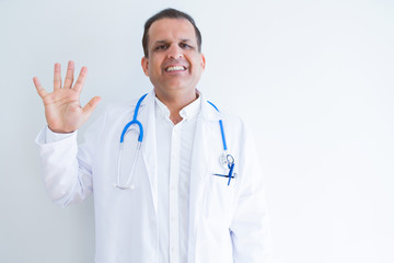 Middle age doctor man wearing stethoscope and medical coat over white background showing and pointing up with fingers number five while smiling confident and happy.