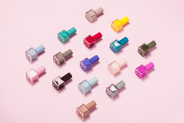 Nail polish bottles pattern background. Close up.