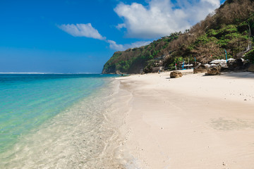 Tropical sandy beach with blue ocean in paradise island
