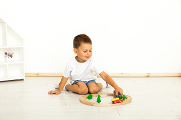 Boy playing with toys indoors at home