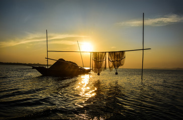 lonely boat while sunset 