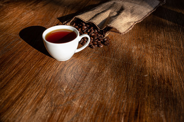 espresso and coffee beans on a table