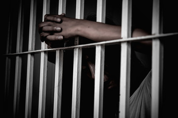 Hands of women desperate to catch the iron prison,prisoner concept,thailand people,Hope to be...