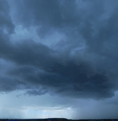 Heavy storm clouds, panorama. Powerful cumulonimbus clouds in front of heavy rain or hail.