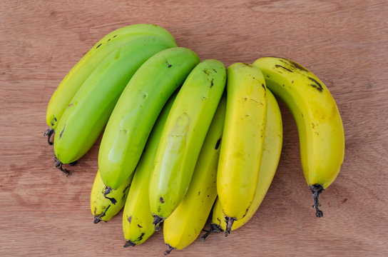 Hand Bananas On Board Surface