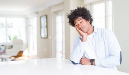 African American man at home thinking looking tired and bored with depression problems with crossed arms.