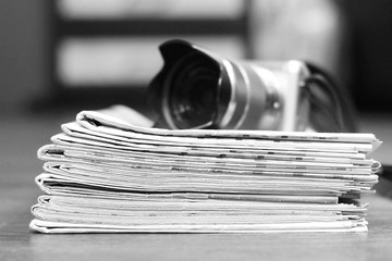 Newspapers and Photo Camera. Concept for News and Journalism