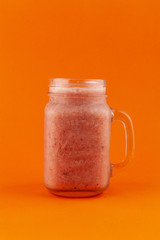 Smoothie with banana, strawberry and kiwi, isolated on bright background