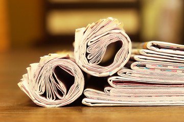 Newspapers and Magazines. Pages with News Folded adn Rolled and Stacked in Pile. Tabloid Journals...