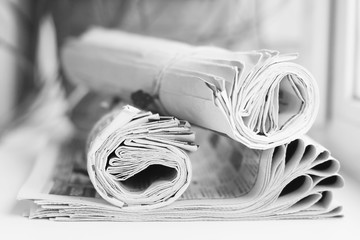 Newspapers and Magazines. Pages with News Folded adn Rolled and Stacked in Pile. Tabloid Journals with Headlines and Articles