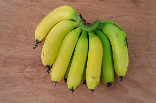 Banana Hand With Yellow Ripe And Green Mature Fingers