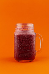 Berry smoothie with raspberry, blueberry and banana, isolated on bright background