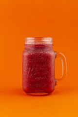 Cherry smoothie with kiwi and banana, isolated on bright background