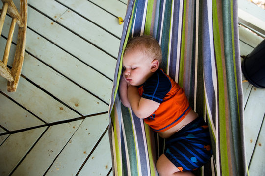 Close up of Toddler Sleeping in Hammock in Tropical Setting