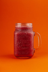 Cherry smoothie with kiwi and banana, isolated on bright background