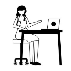 female doctor working desk laptop