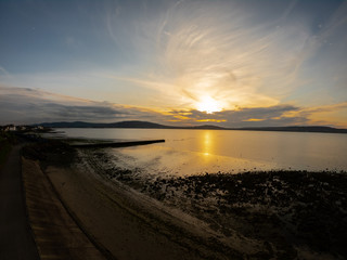 Obraz premium Beautiful colorful sunset above coast of Irish Sea in Holywood Northern Ireland. 