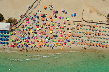 Torre Dell'Orso, Lecce, Puglia, Italy. Aerial top down view of the crowded beach and the sea