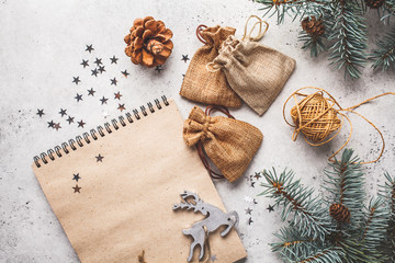 Christmas background with Christmas tree and notepad, copy space for text.