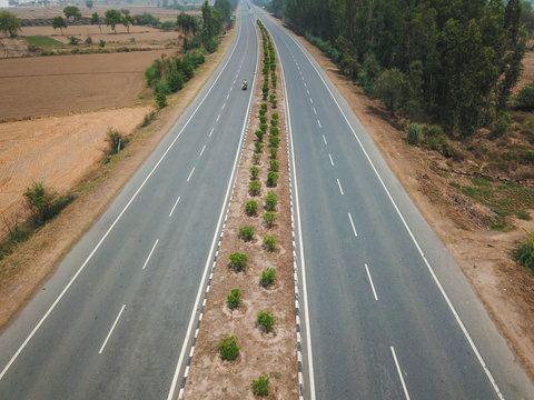 Aerial view of a bike passing through the highway road on Gohana bypass