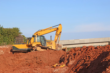 Obraz premium Digger on a road construction site