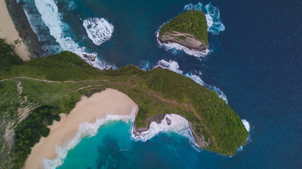 Top aerial view of the t-rex cliff at Kelingking beach ona fine bright day in Nusa Penida, Indonesia