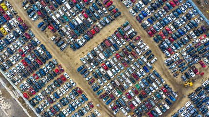 Aerial view of rows of old cars that have served, assembled in a junk yard waiting to be recycled for their reusable parts, Aurora, IL, USA.