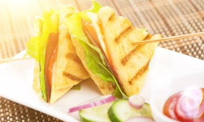 Fresh tasty sandwiches on white plate