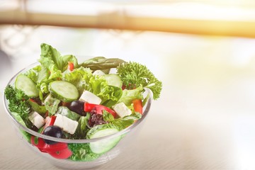 Closeup of Greek salad with feta cheese, cherry tomatoes and lettuce