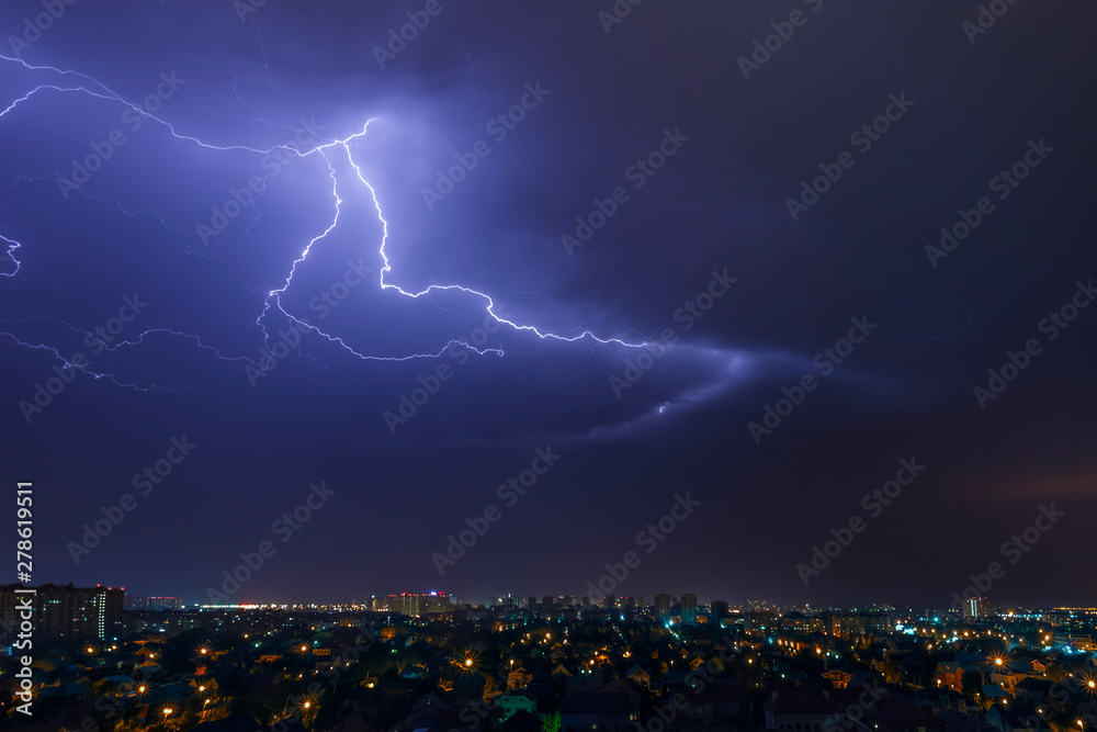 Wall mural urban landscape, thunderstorm and lightning across the sky