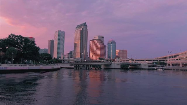 Aerial: Establishing shot of Tampa at sunset over the Hillsborough Bay. Florida, USA. 3 July 2019. 