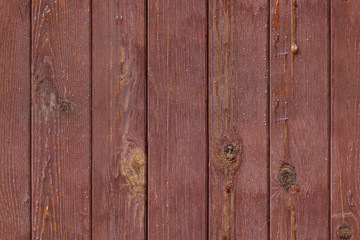 Seamless photo pattern of red wooden planks fence.