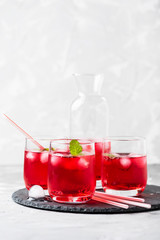 Red alcoholic coctail with ice and mint