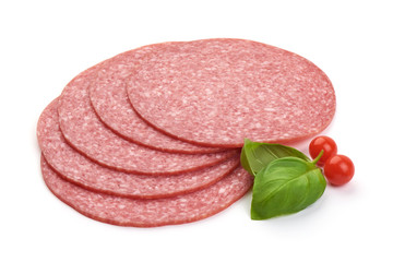 Thin salami sausage slices with basil leaves, close-up, isolated on white background