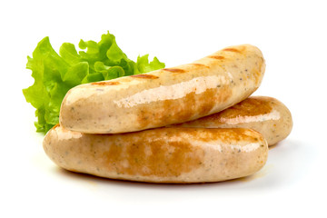 Grilled Munich sausages with lettuce, isolated on white background
