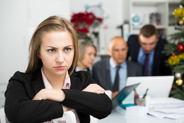 Frustrated woman sitting at office