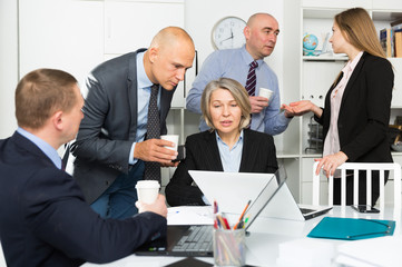 Confident business people planning projects at brainstorming in office