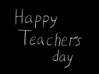 Happy Teacher's day - white inscription on a black board, handdrawn typography poster. Vector illustration.