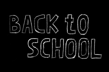 Welcome back to school sale vector hand drawn lettering inscription with decorative elements isolated on black background.