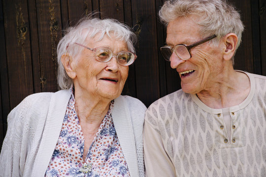 Portrait of two laughing senior friends. Great grandparents together.