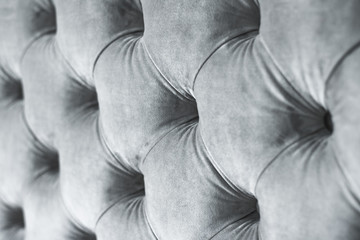 Silver luxury velour quilted sofa upholstery with buttons, elegant home decor texture and background