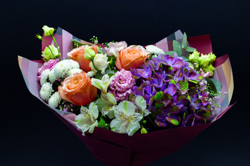Obraz na płótnie Canvas bright contrasting bouquet assembled from hydrangea, peony rose, chrysanthemum, eustoma and alstroemeria
