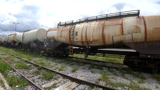 Wagon for liquids waits for further transportation on train depot