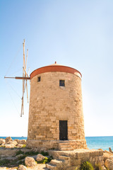 Fototapeta na wymiar Rhodes Windmill in Mandraki Harbour, Rhodes, Greece
